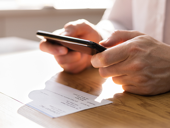 closeup of someone using mobile deposit