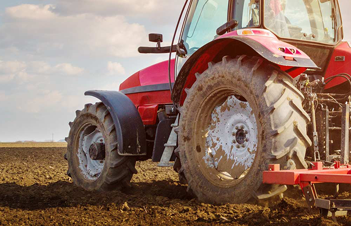 tractor tilling a field